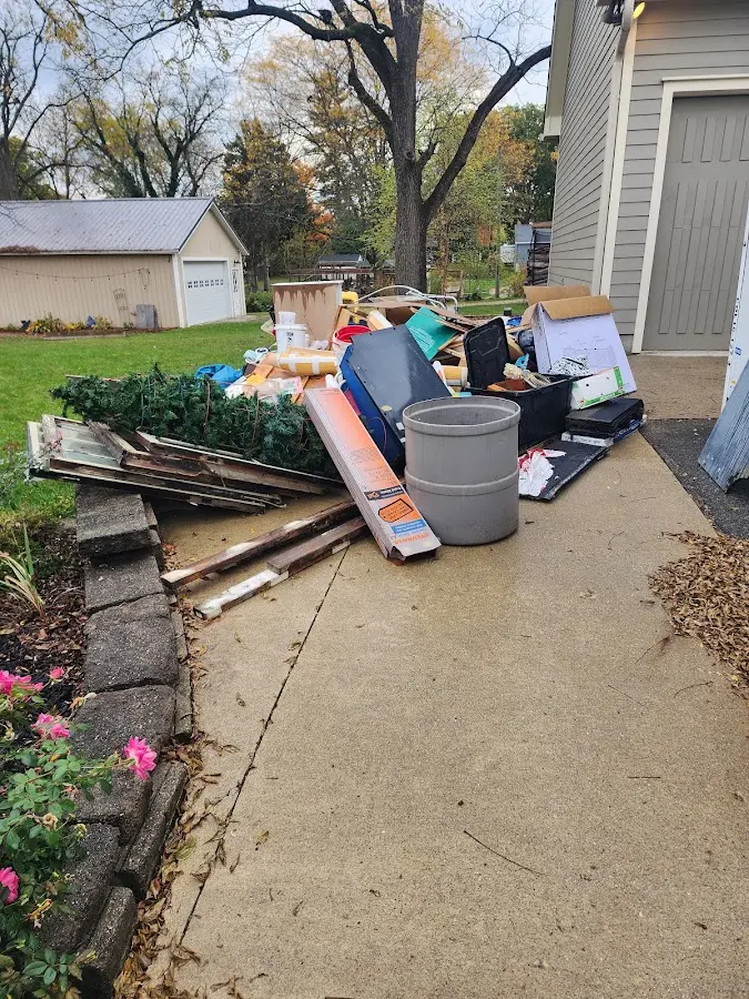 Dumpster being loaded with debris for Residential Dumpster Rental in Aledo